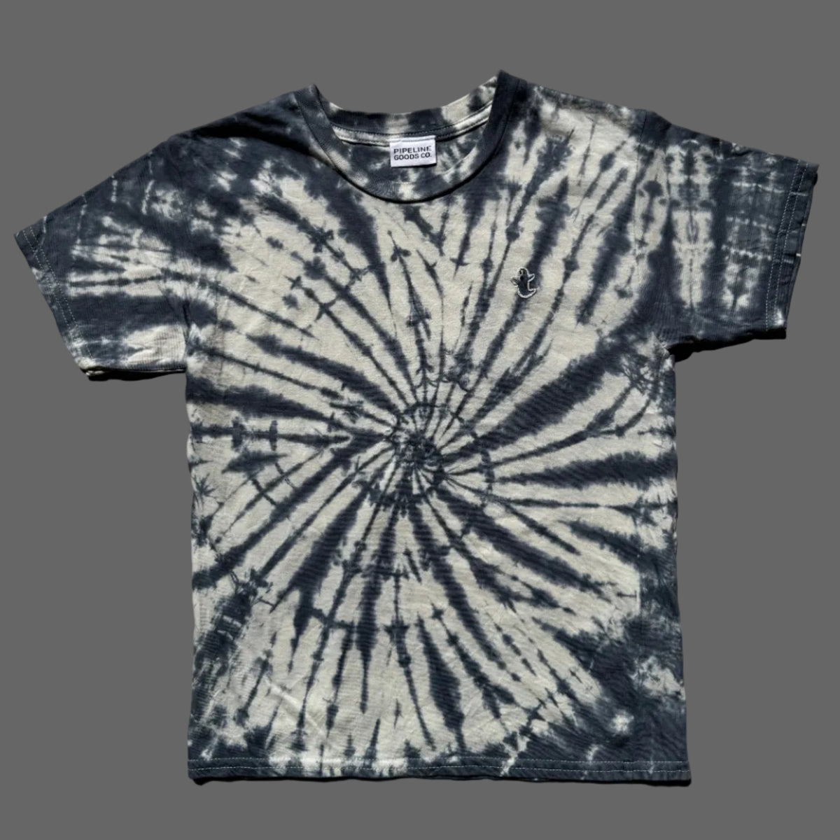 A short-sleeve crewneck tie-dye t-shirt with a spiral pattern in midnight blue and off-white with a small hand embroidered ghost on the right pocket area.